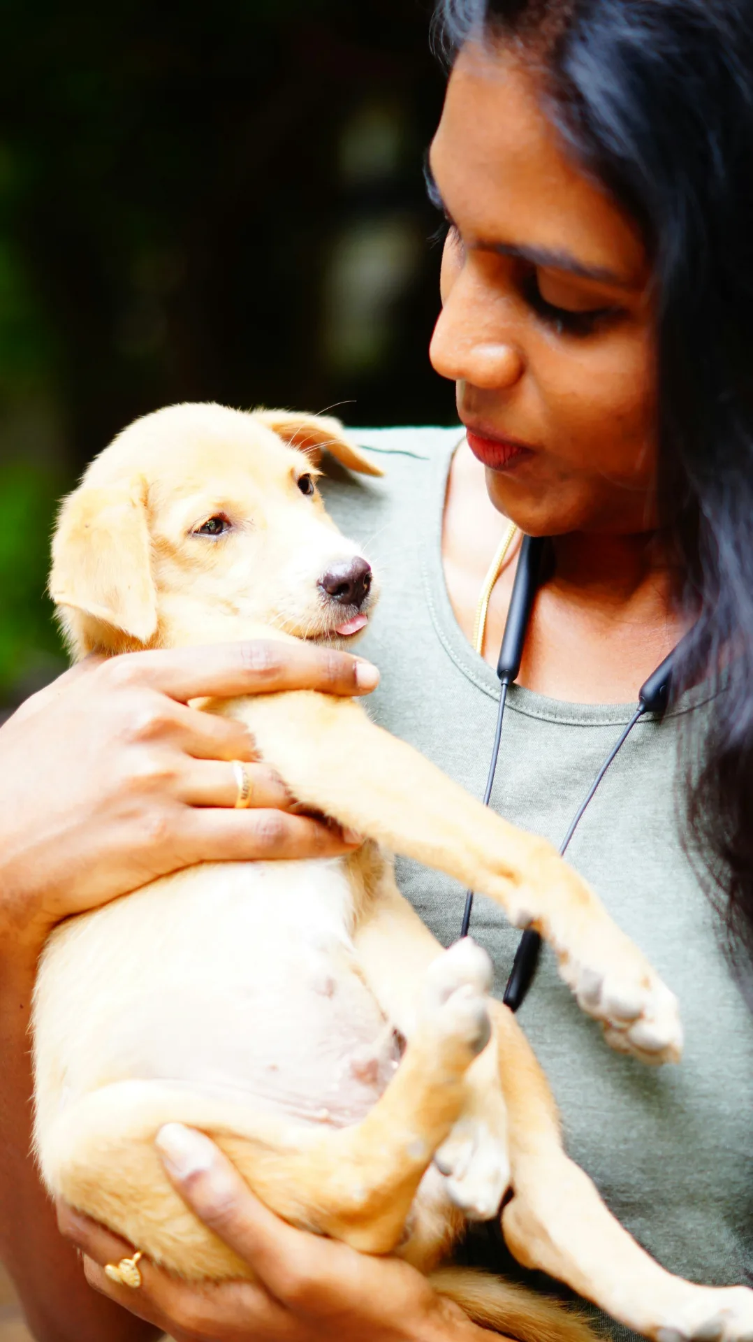 Woman holding puppy, welcoming new patients